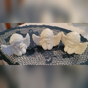 Cream porcelain cherub trio